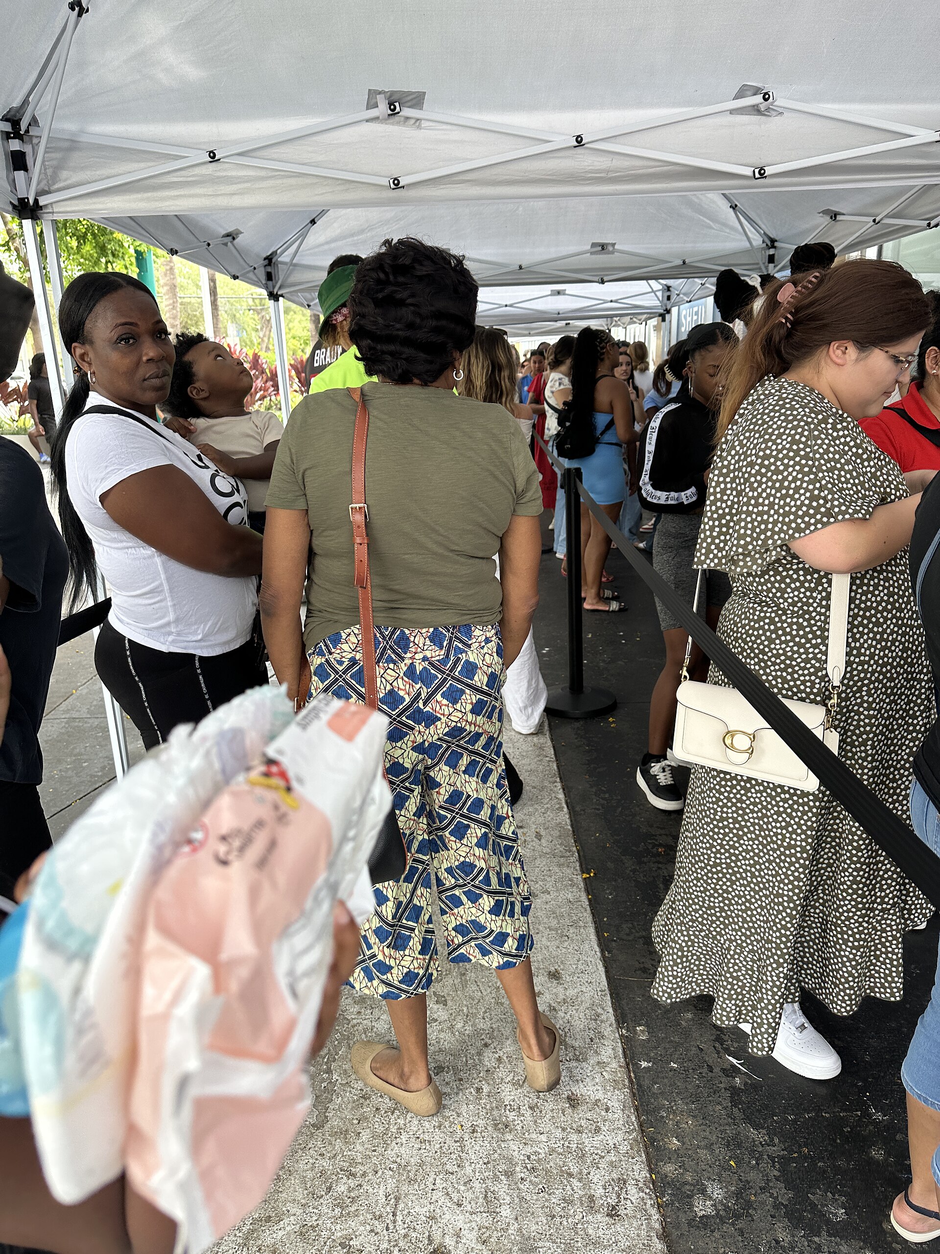 Shoppers wait to enter a Shein pop-up store in South Beach, Florida, in June 2025.
